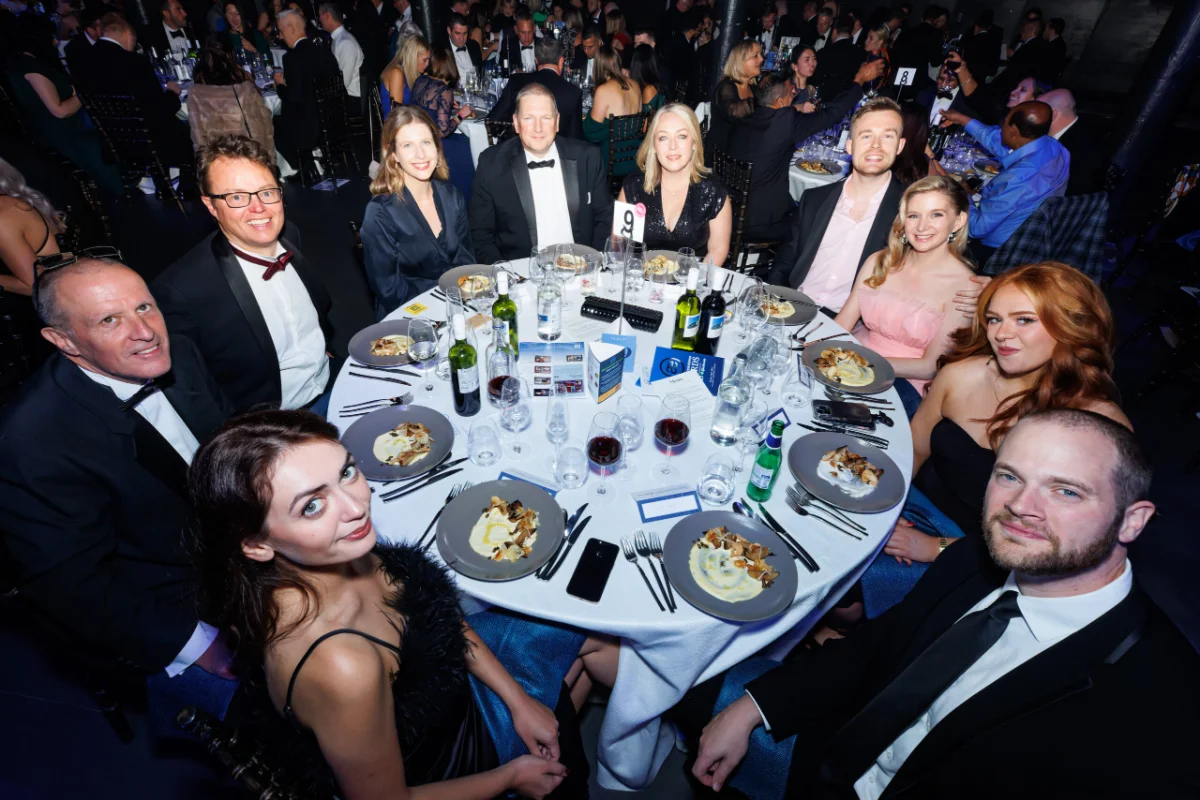 The striveX team at a black-tie industry awards dinner.