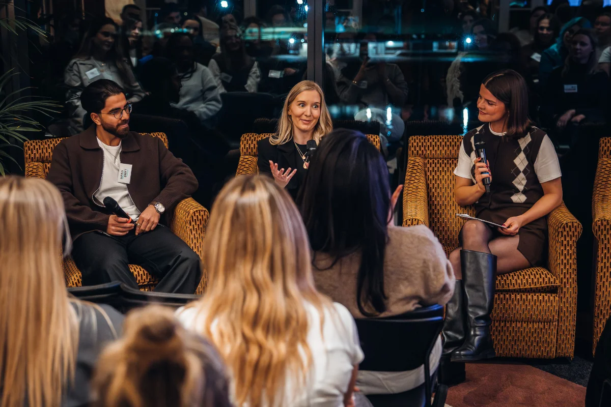 A striveX speaker on a panel discussion at a business event.